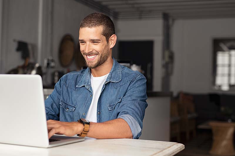 Man using softphone on a laptop