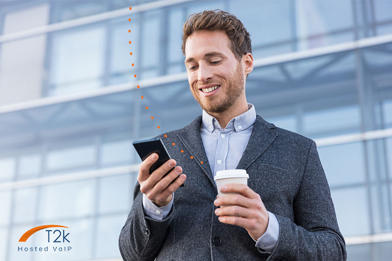 Young Estate Agent making calls on VoIP phone