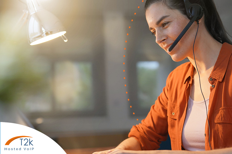 Call centre worker working from home using VoIP phone system