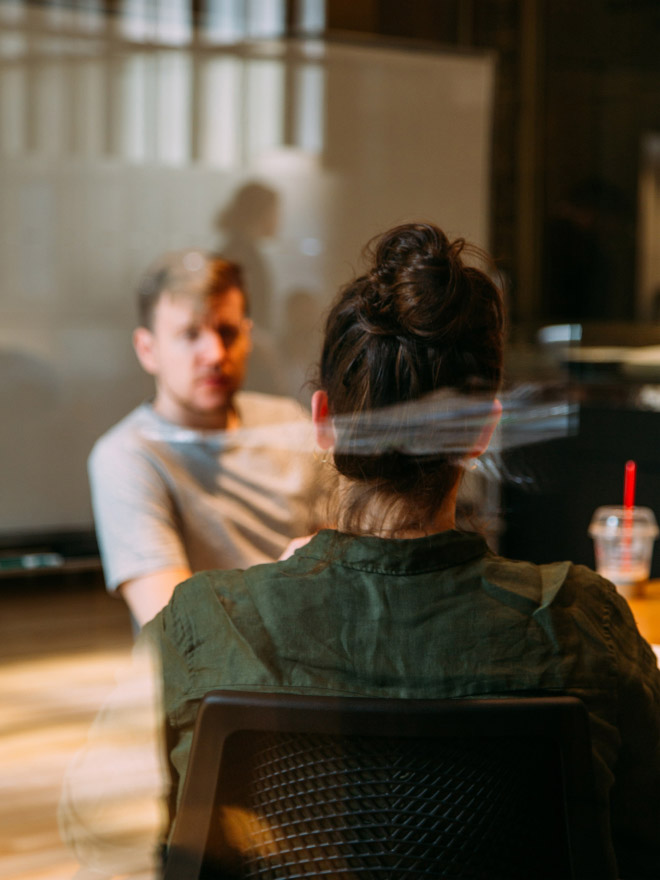 Two people in one room cunducting an interview