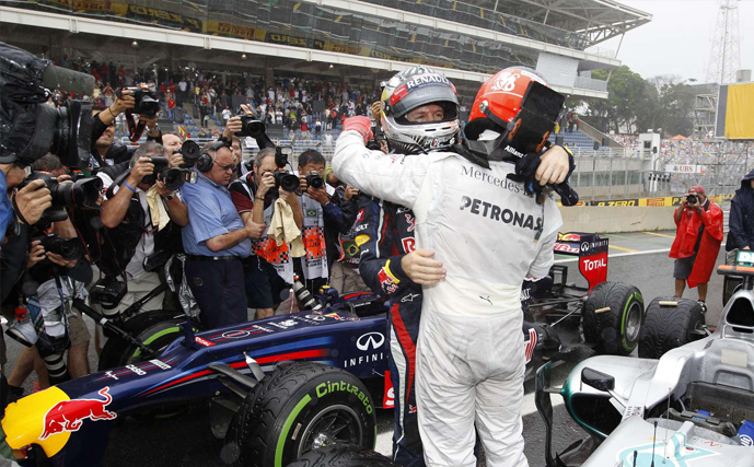 Michael Schumacher and Sebastian Vettel embrace after the 7 time World Champion’s last race at Interlagos (Brazil, 2012)
