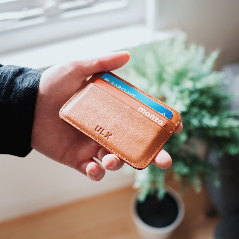 Monzo's hot coral card poking out