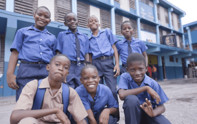 Shot of school kids smiling in their uniforms