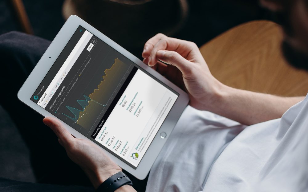 A man using Power Ledger's P2P trading platform on an iPad