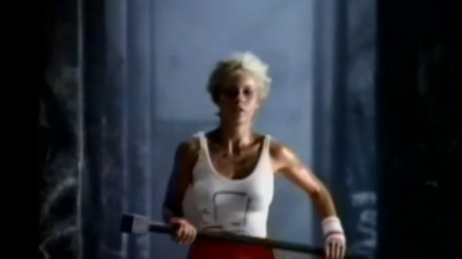 A female Olympian runs wielding a hammer