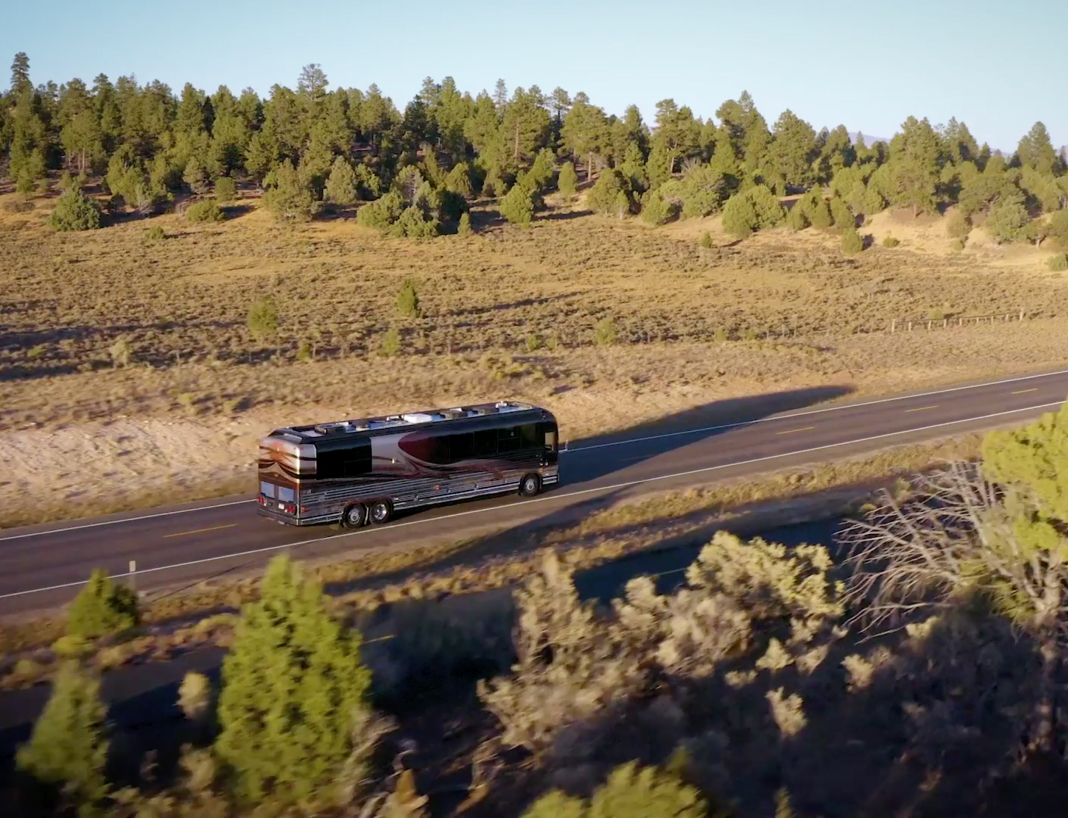 Landscape shot of an RV traveling down an interstate.