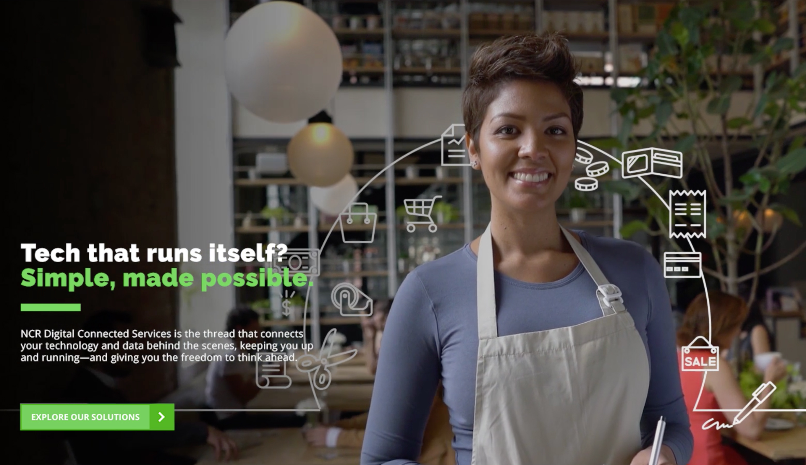 A woman smiles while shopping at a grocery store.