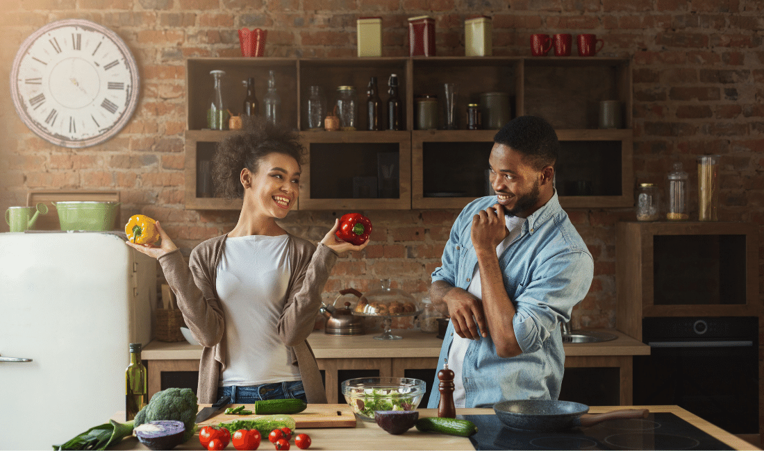 Young couple cooking in their kitchen