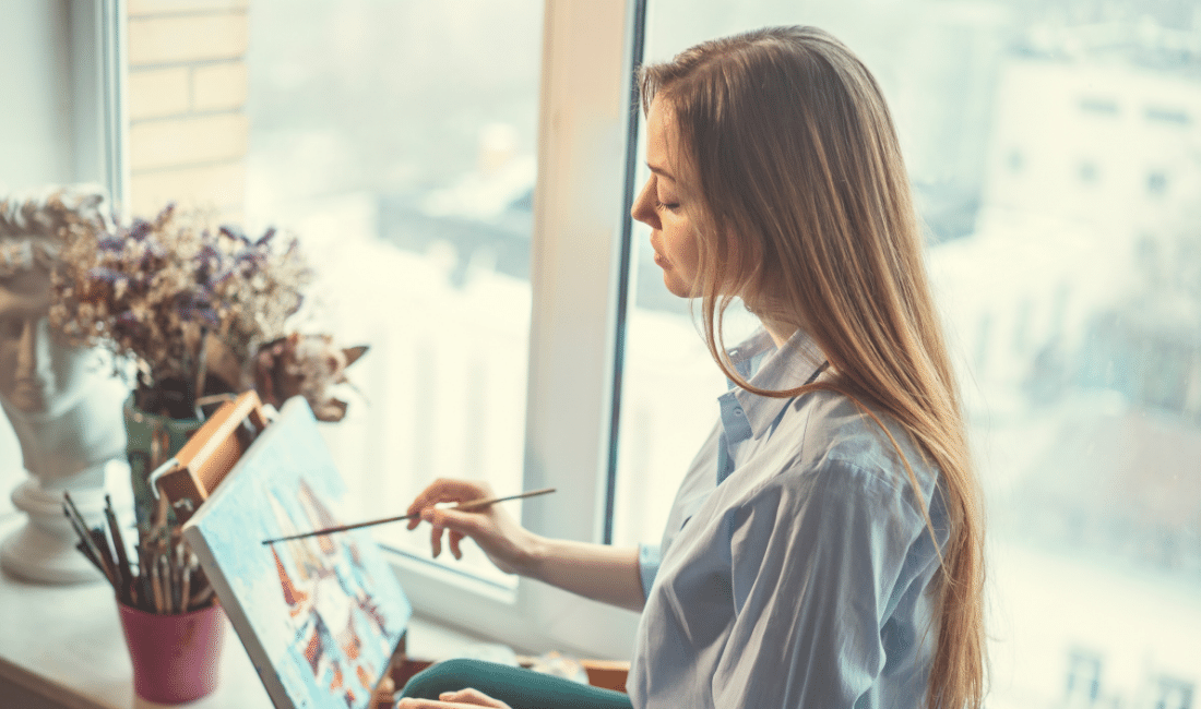 A lady painting in her room