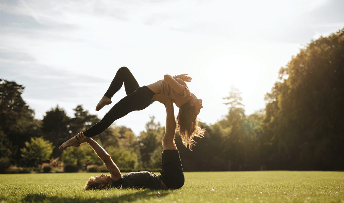 Couple doing Yoga in Park