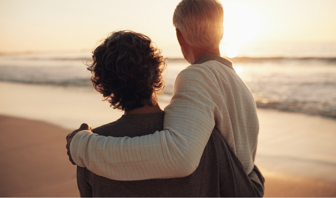 Senior couple watching the sunset