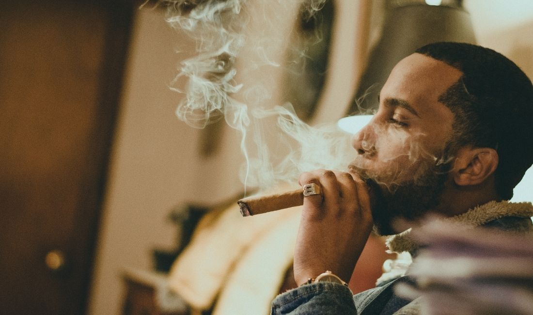 Man smoking cigar