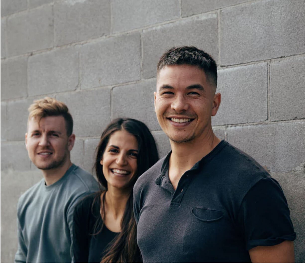 Three developers welcoming 