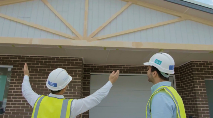 Co-founders Sam and Antonny observing a project they are building