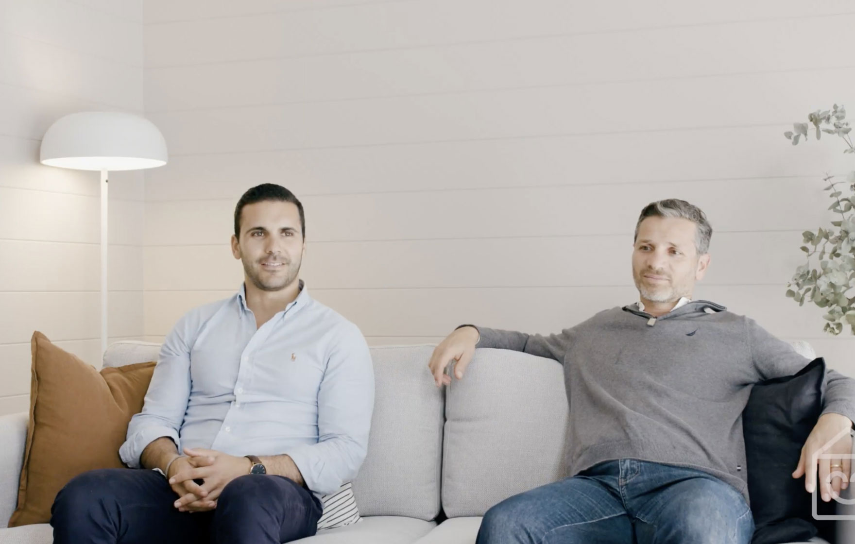 Co-founders Antony and Sam sitting on a couch telling a story
