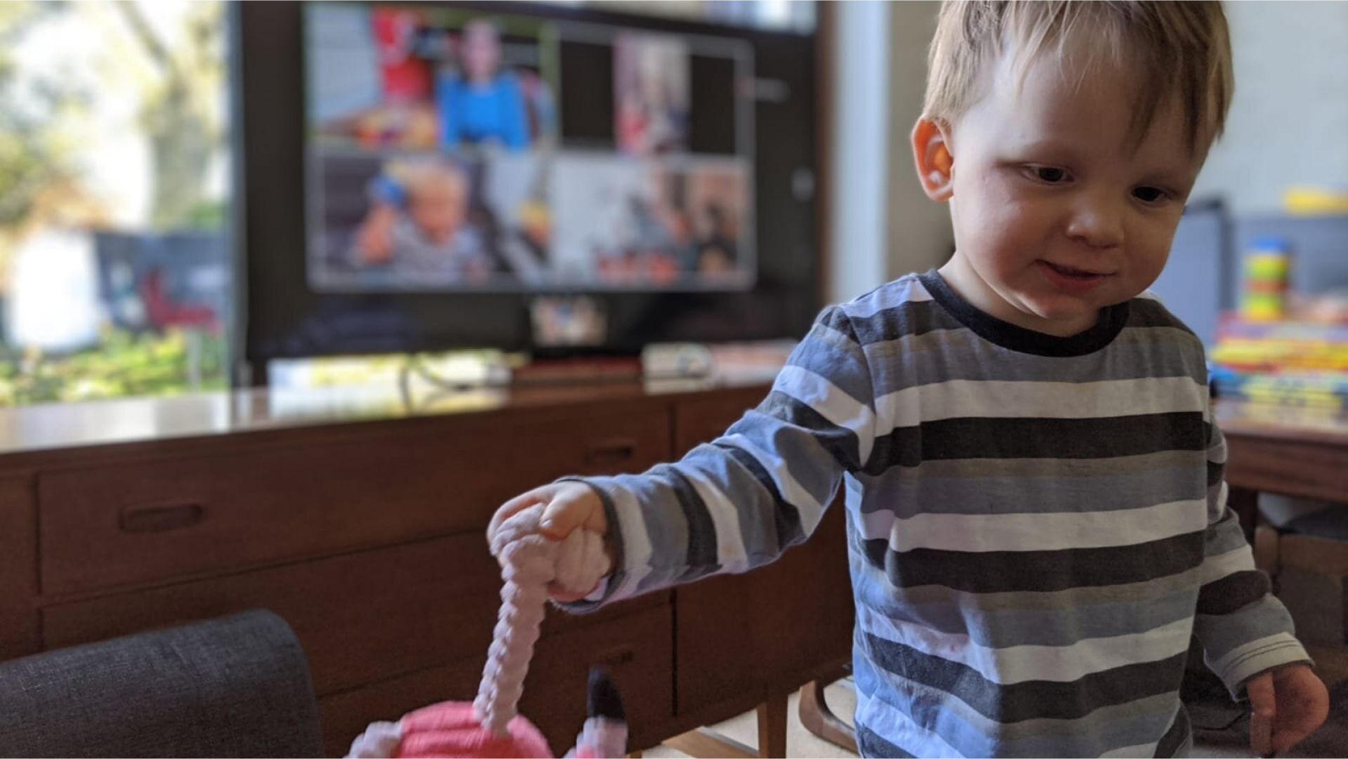 Photo of a boy holding a toy