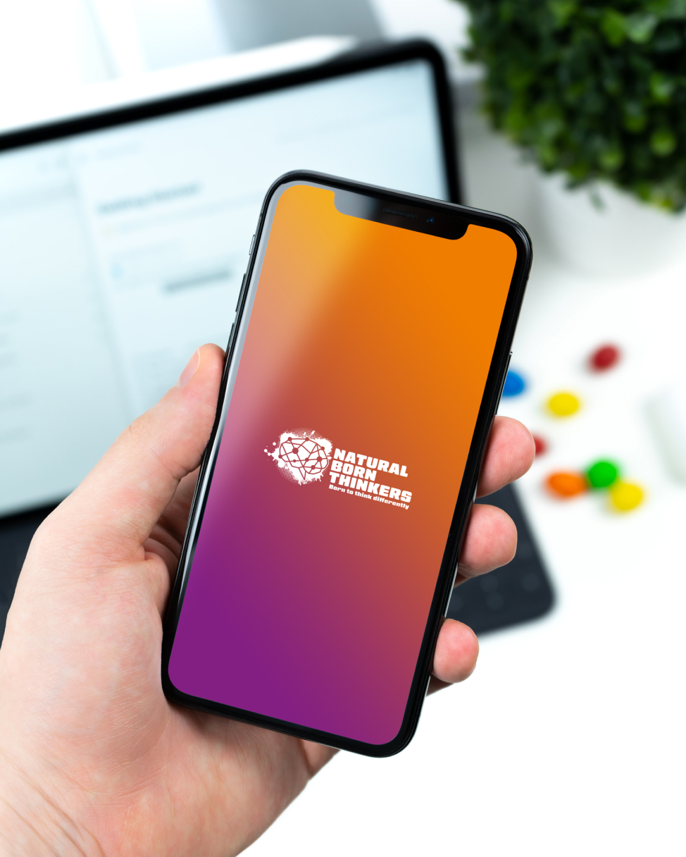 Natural born thinkers logo design on a smartphone screen.