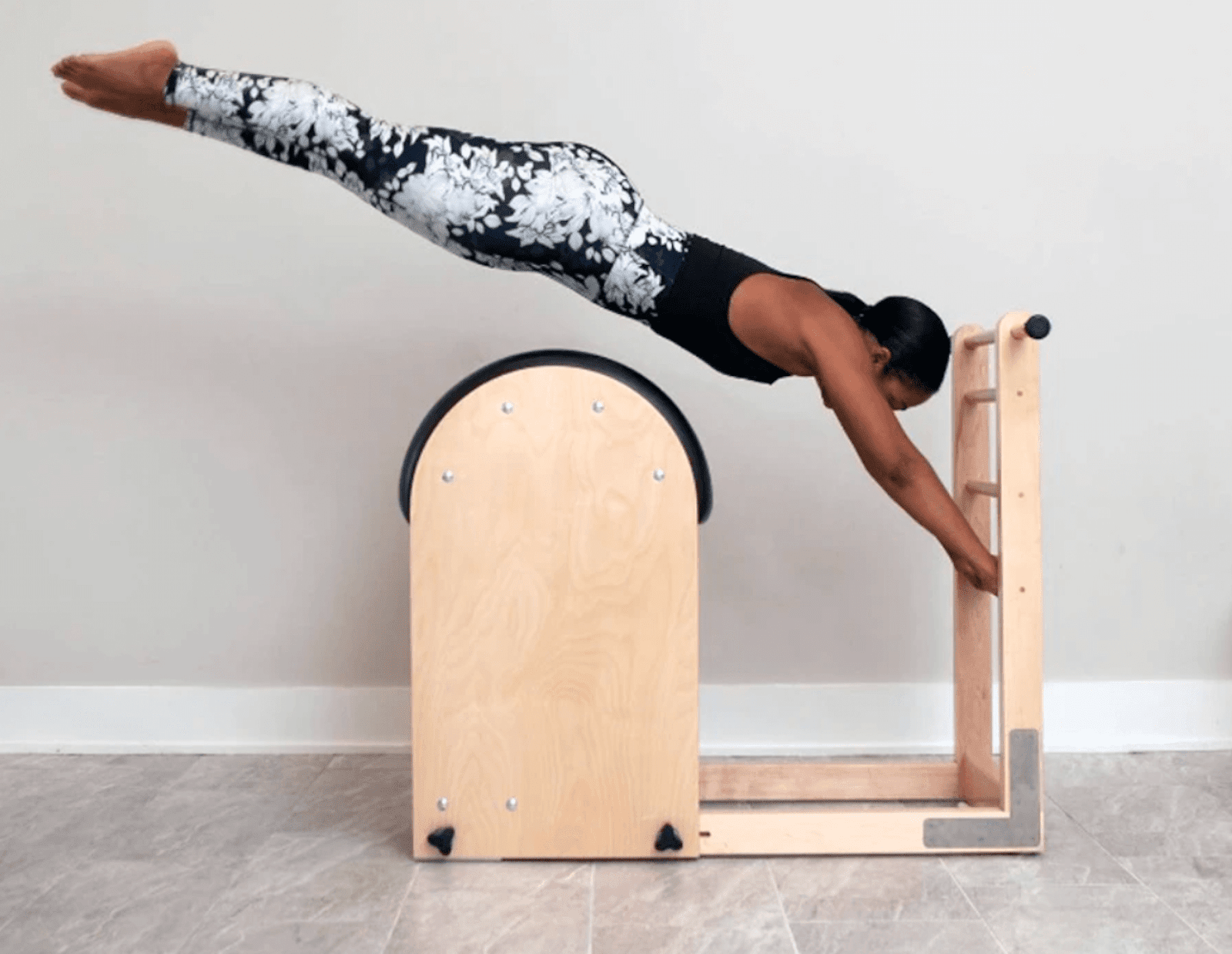 person using a Gratz Pilates machine