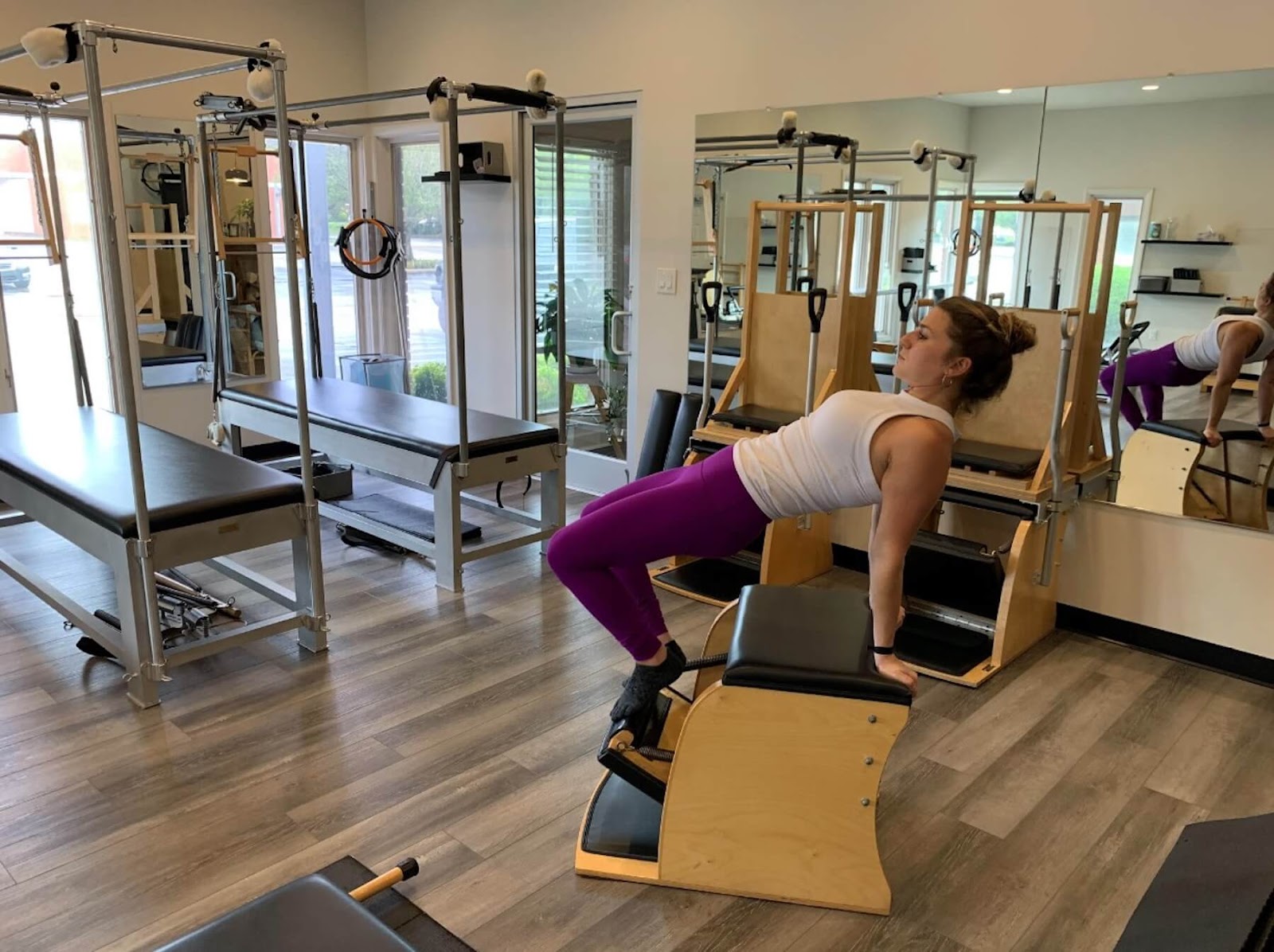 woman using a Pilates machine