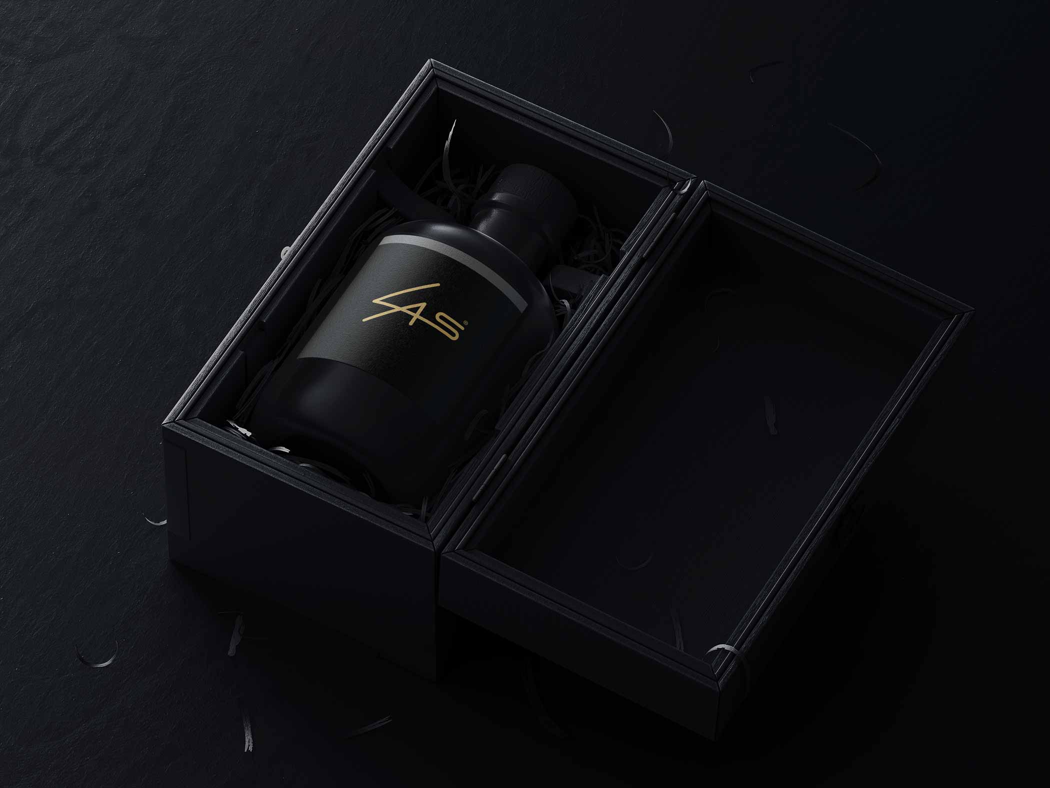 Gold LAS Design logo on black bottle