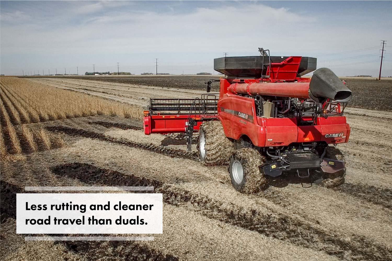 Case IH combine with Goodyear LSW1250/35R46 super single tires going through mud