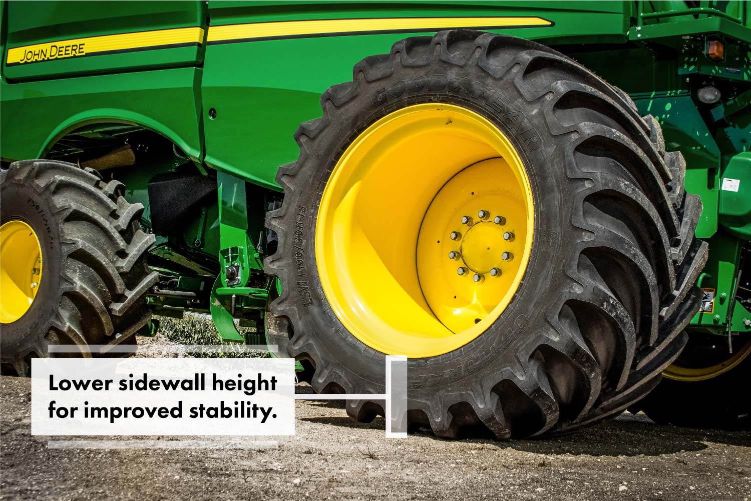 A John Deere combine with Goodyear LSW1400/30R46 super single tires.