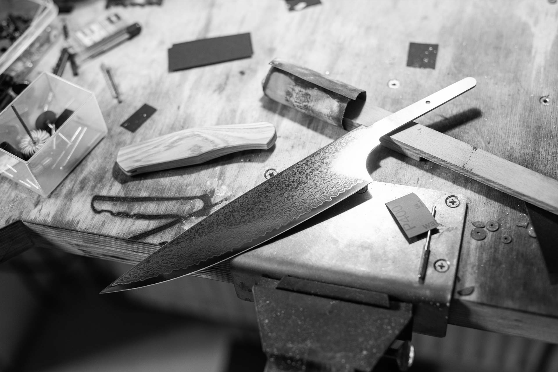 Handcrafted kitchen knife on work table