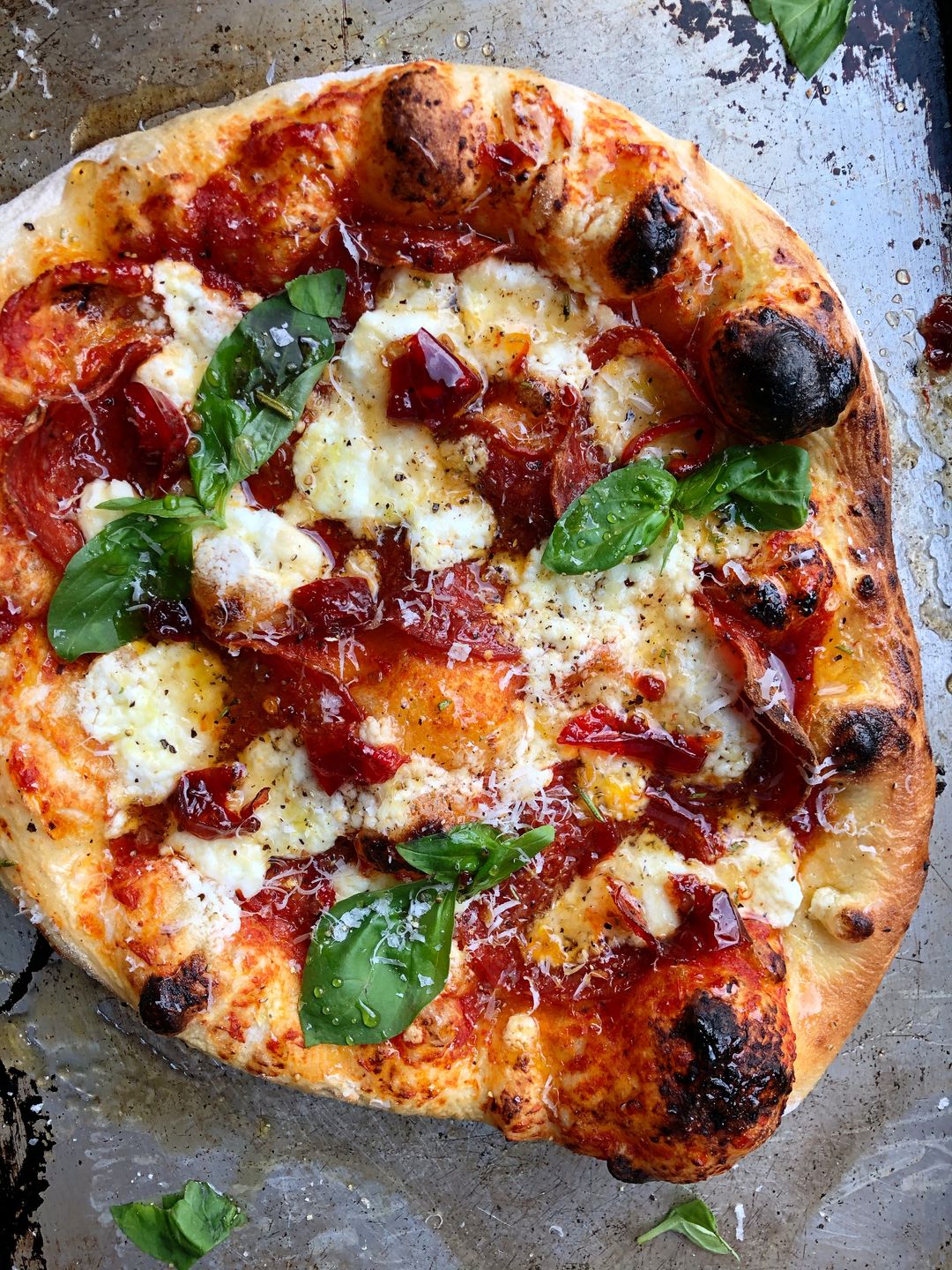 Goat Cheese and Soppressata Pizza with Calabrian Chile Hot Honey and Basil Sara Tane