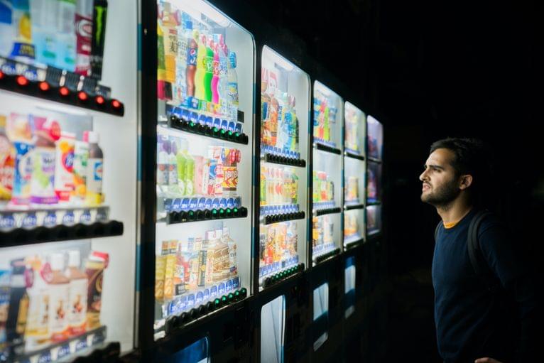 Decktopus - A man standing in front of a fridge