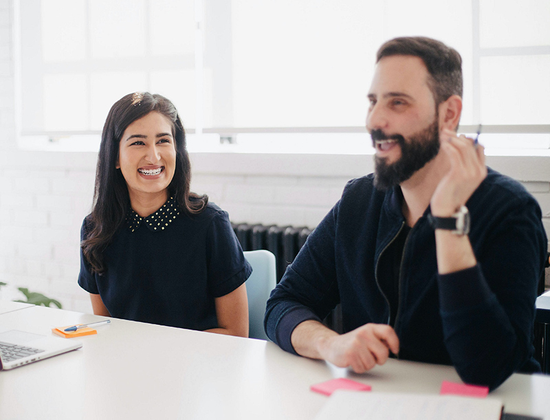 a man and woman smiling