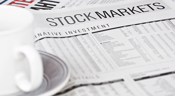 newspaper with a headline that says "stock market'