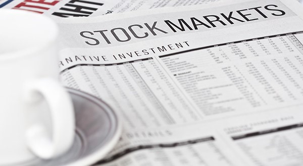closeup a newspaper page of the stock market