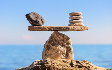 stacked stones balanced on a rock