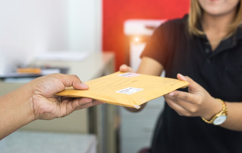 woman receiving envelope