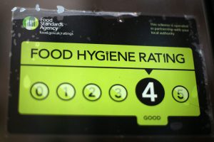 LONDON, ENGLAND - FEBRUARY 09: A Food Standards Agency rating certificate is pictured in the window of a restaurant on February 9, 2015 in London, England. Claims have been made that some restaurants are ignoring food hygiene standards ratings. (Photo by Carl Court/Getty Images)
