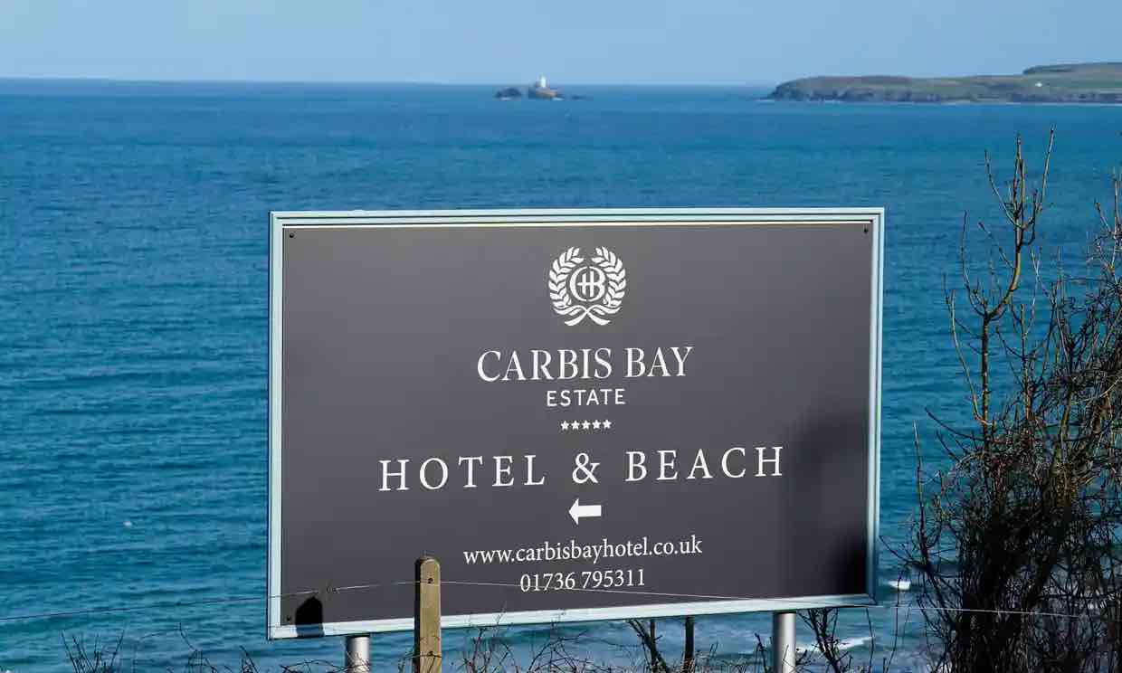 a sign pointing towards Carbis Bay Estate. Photo by Hugh Hastings / Getty Images.