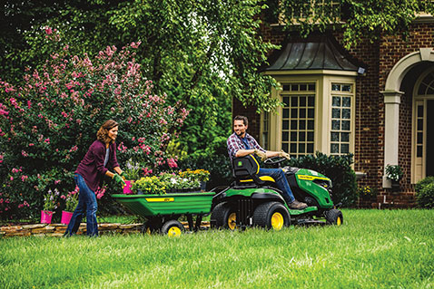 people mowing the lawn