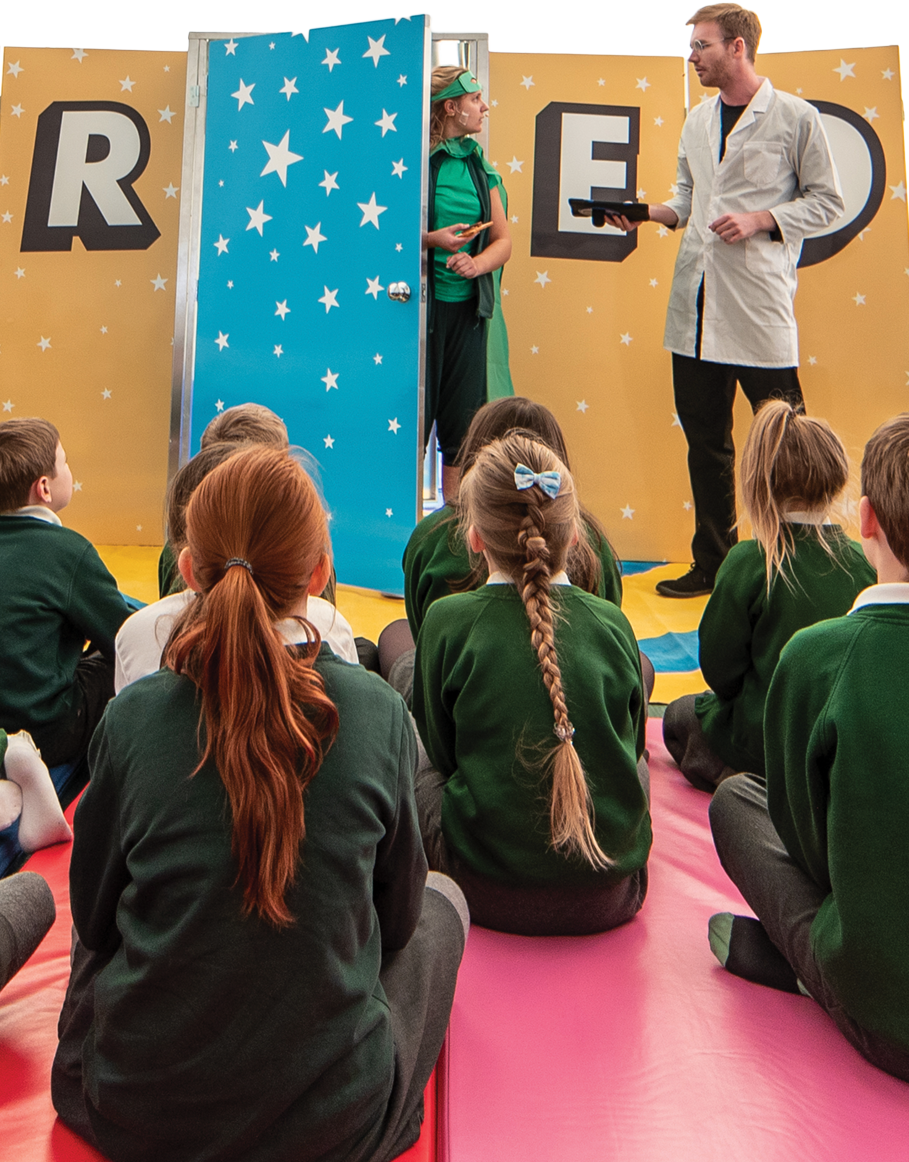 FRED and the Professor performing the experience to school children