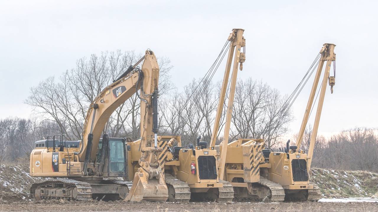 civil engineering equipment yellow x3