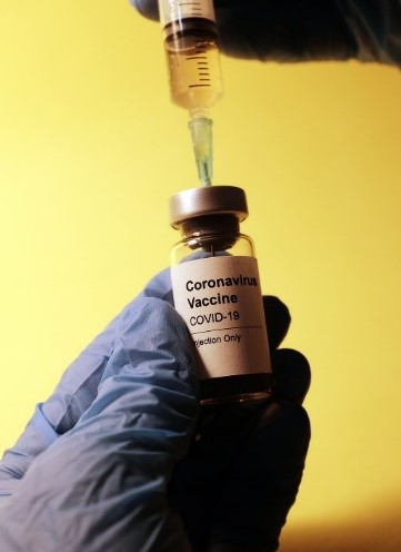 holding covid-19 vaccine