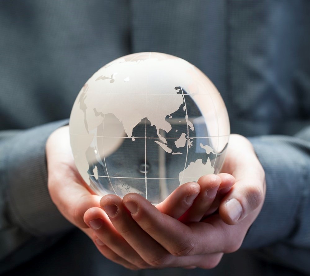 a person holding the globe