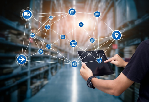 a person using a touch screen in a warehouse that connects him to other services