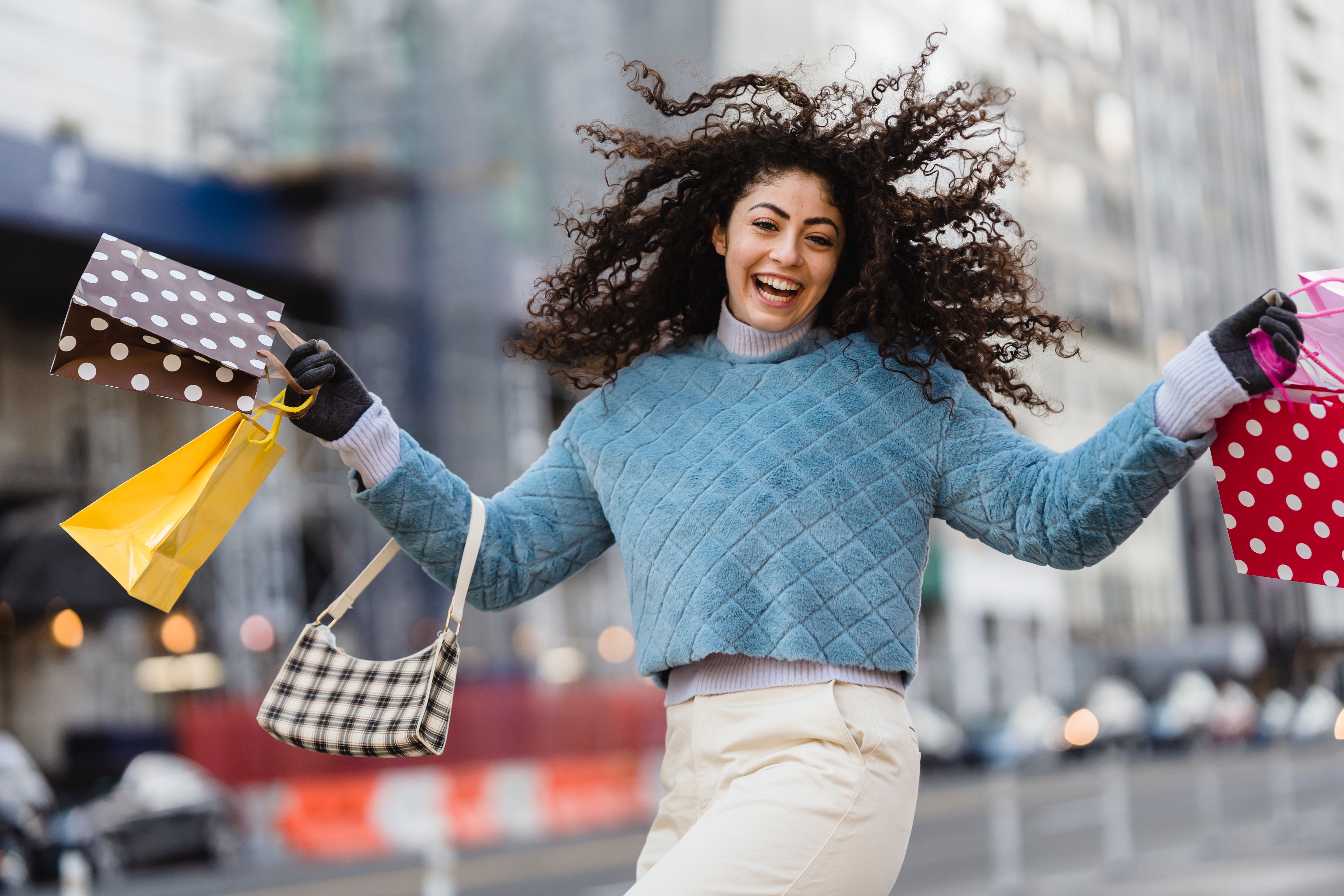 A happy woman with shopping bags