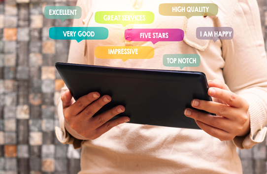 A person using a tablet to assess customer service experience
