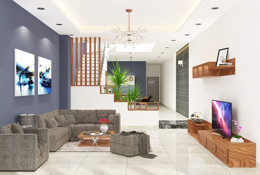 Phòng khách nhà ống 2 tầng có thiết kế đơn giản, tiết chế tối đa đồ nội thất, chỉ sử dụng những sản phẩm thiết yếu như sofa, kệ tivi, bàn trà. Cầu thang kiêm vách ngăn trang trí đẹp không gian tiếp khách và nhà bếp.
