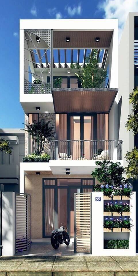 hình ảnh mẫu nhà 3 tầng được thiết kế lùi vào trong, cửa kính, ban công thư giãn