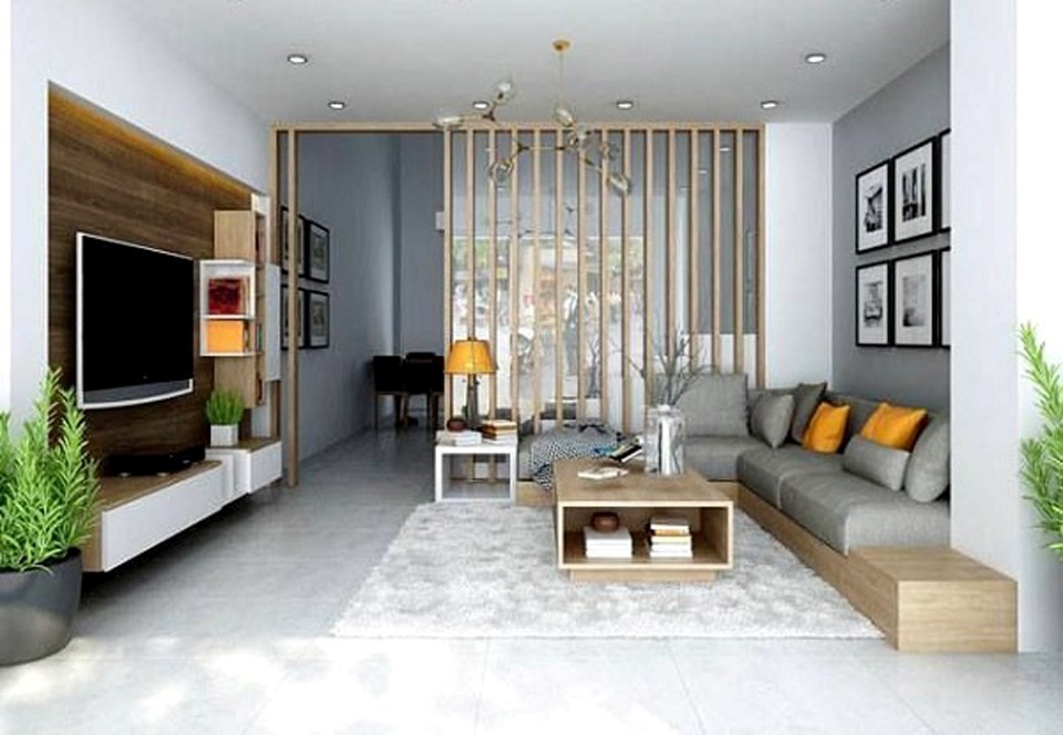 Hình ảnh phòng khách nhà cấp 4 với sofa xám, tủ kệ tivi, cây xanh trang trí hai bên