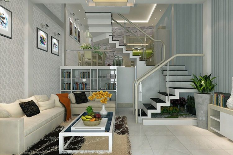 Những chậu cảnh nhỏ xinh giúp phòng khách có cầu thang sinh động và mềm mại hơn.
