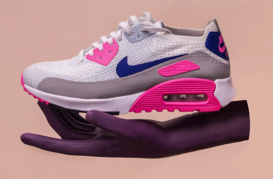 Heavily compressed image of Nike shoe