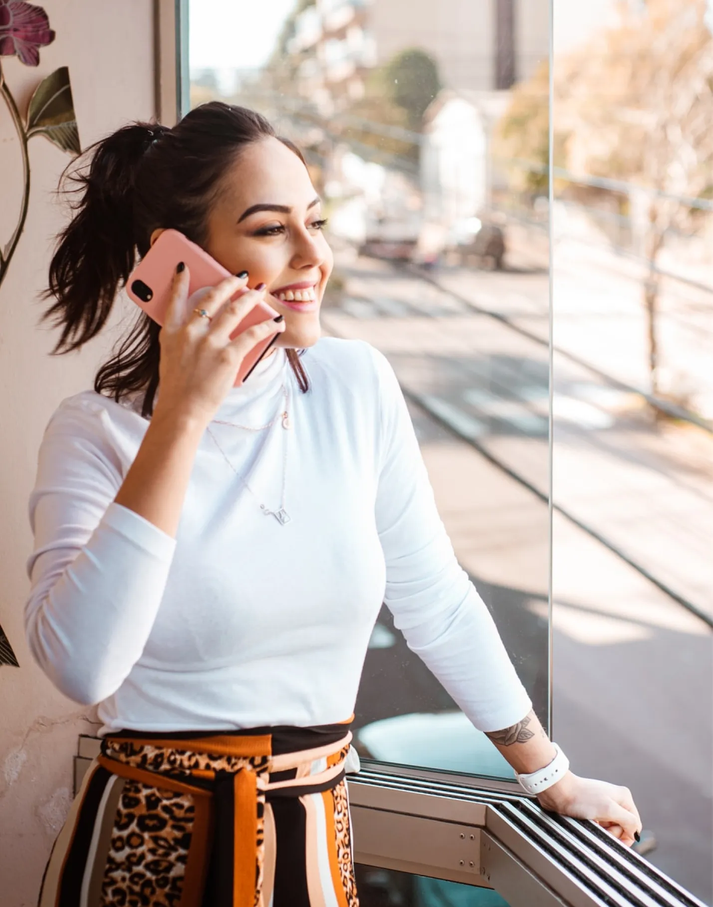 Young, millennial woman talking on her phone